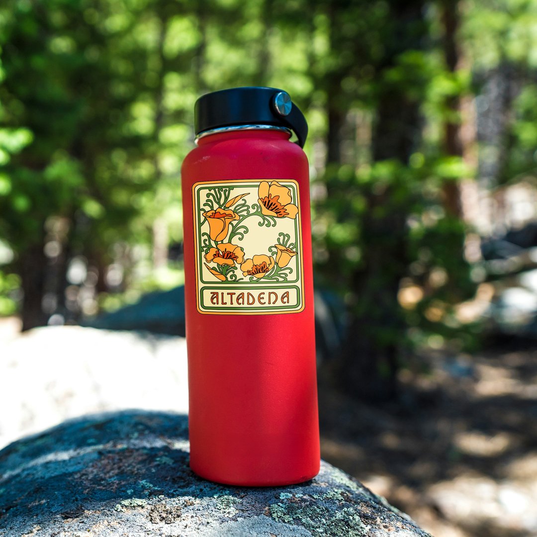 Altadena Poppy sticker applied to a red water bottle