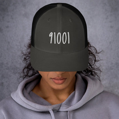 Model wearing the charcoal 91001 trucker hat