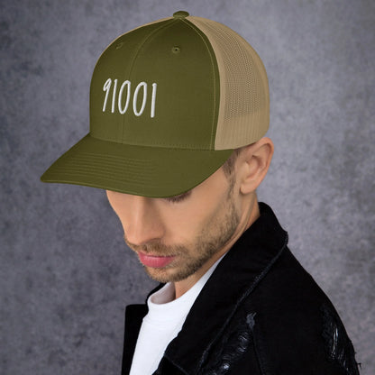 Model wearing the moss and khaki 91001 trucker hat
