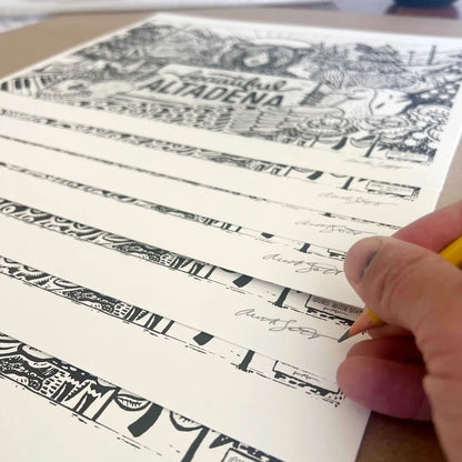 Artist signing Beautiful Altadena black-and-white prints