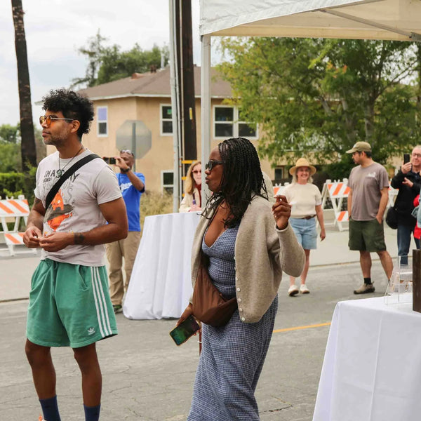 Attendees chatting in the street at Webster's 100th anniversary fair