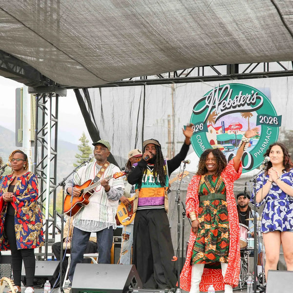 Band taking a bow on stage at Webster's centennial street fair