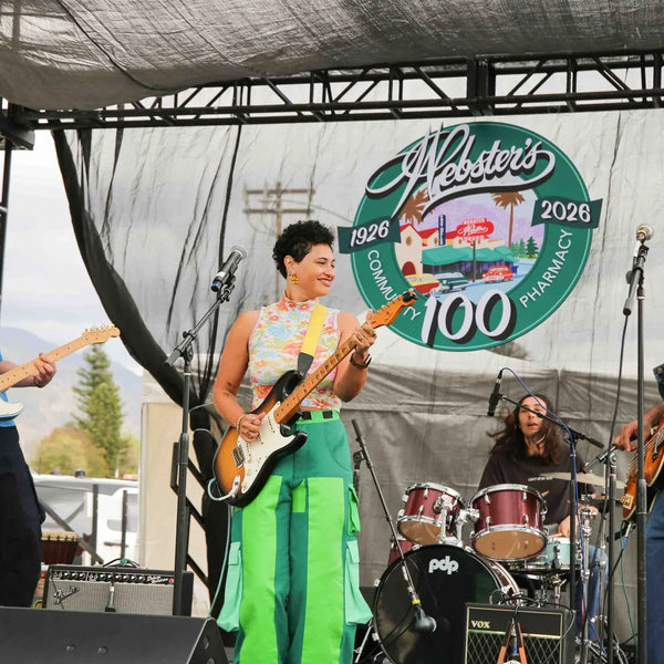 Live band performing beneath the Webster's 1926-2026 anniversary logo