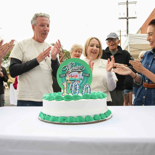 Applause around the centennial cake at Webster's street fair in Altadena