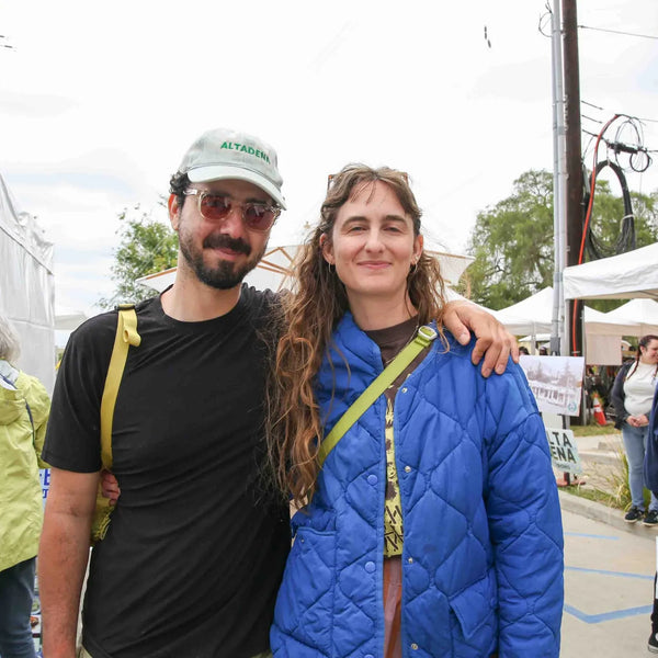Couple posing near the festival tents at Webster's centennial street fair