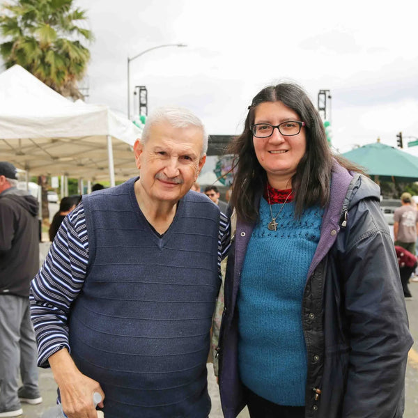 Couple posing in the street at Webster's Pharmacy centennial celebration