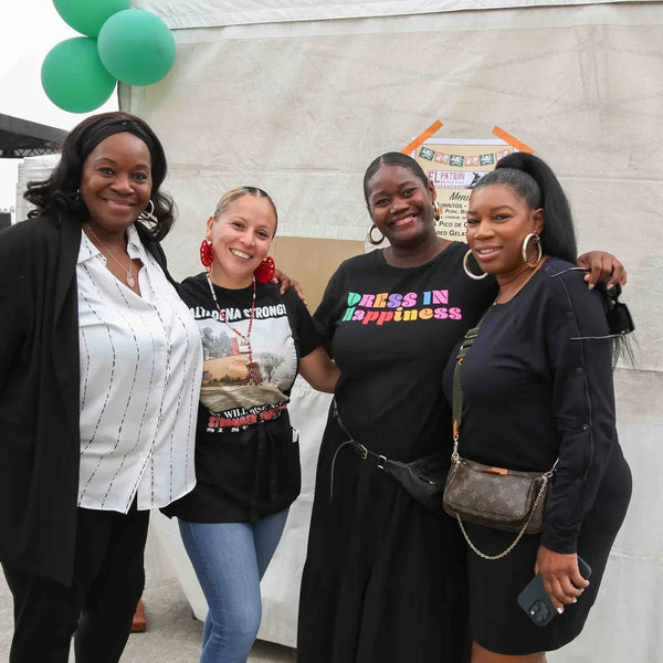 Four friends posing together at Webster's centennial fair in Altadena