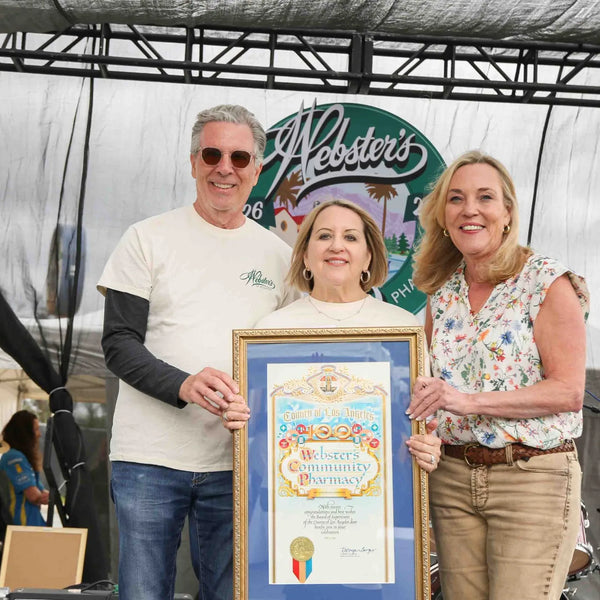 Framed award celebrating Webster's Community Pharmacy's 100 years of service