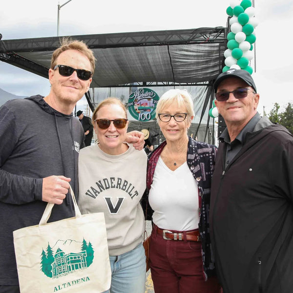 Four friends with an Altadena tote bag at Webster's anniversary street fair