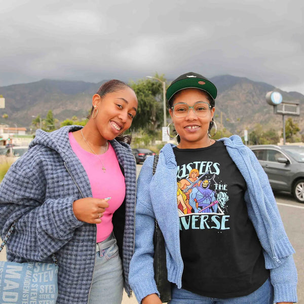 Two friends smiling with the San Gabriel Mountains behind Webster's street fair