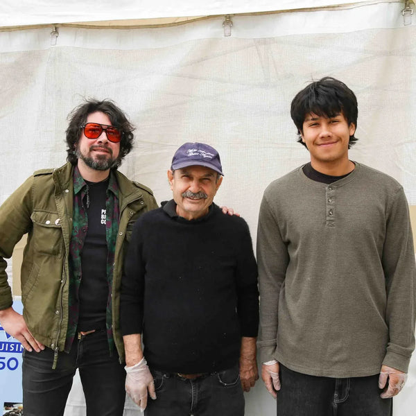 Greek Cafe team posing at their tent during Webster's street fair