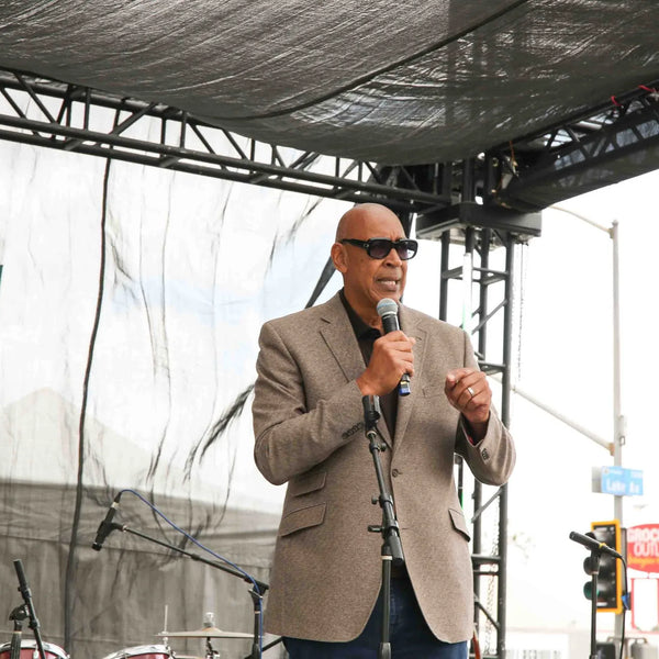 Guest speaker addressing attendees at Webster's 100th anniversary celebration