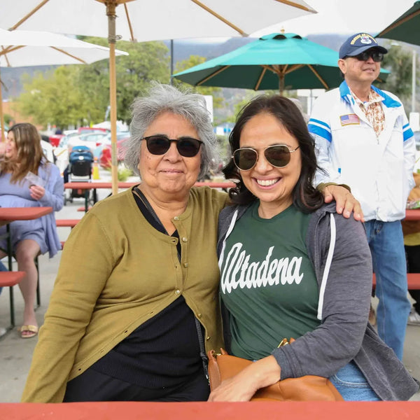 Mother and daughter in an Altadena shirt at Webster's anniversary fair