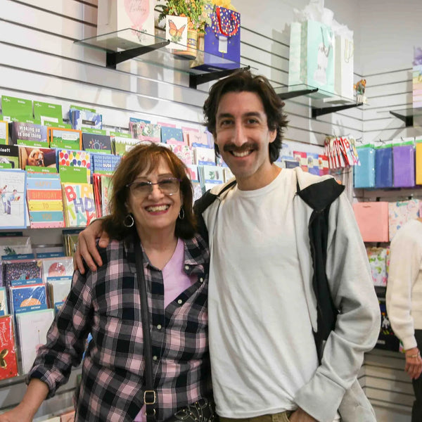 Mother and son by the greeting card wall inside Webster's Pharmacy gift shop