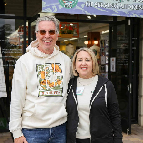 Webster's owners posing at the Village Post Office entrance in Altadena