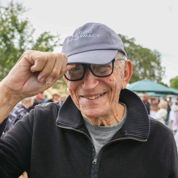 Longtime customer tipping his pharmacy cap at Webster's centennial fair
