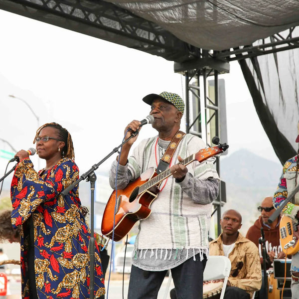 Vocalists and guitarist performing live at Webster's 100th anniversary fair