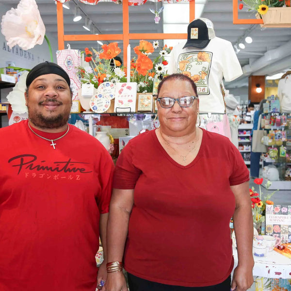 Two smiling customers inside Webster's Community Pharmacy gift shop in Altadena