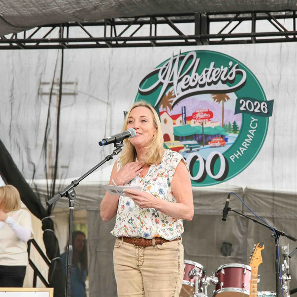 Speaker addressing the crowd during Webster's centennial stage program