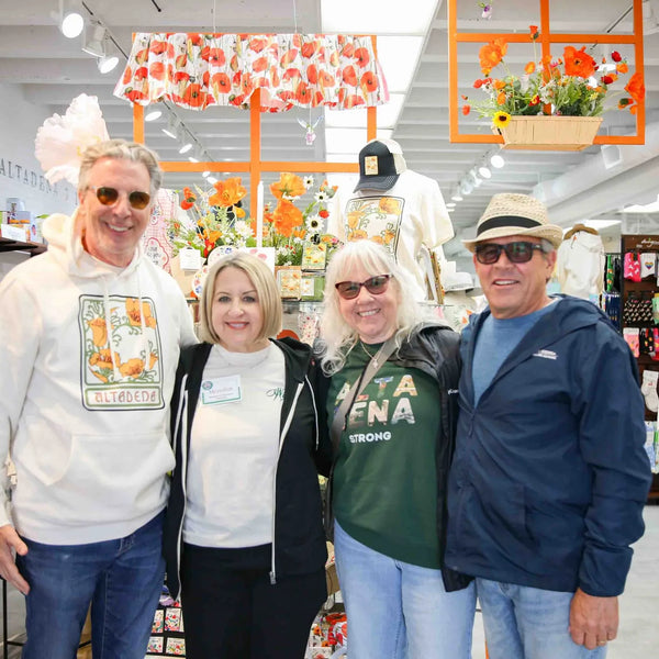 Webster's team members posing inside the pharmacy gift shop in Altadena