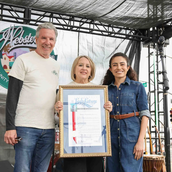 Framed proclamation presented to the Webster's Pharmacy family on stage