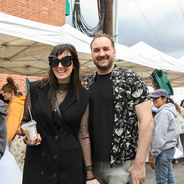 Stylish pair enjoying the vendor row at Webster's centennial street fair