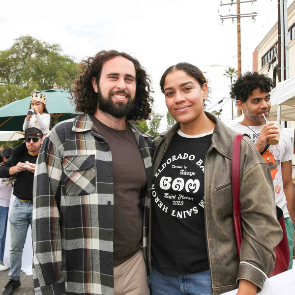 Three friends posing together at Webster's Pharmacy centennial street fair