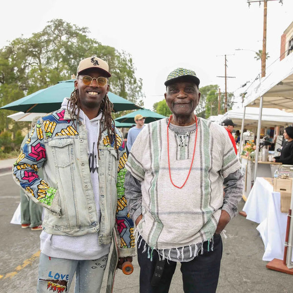 Two friends posing in the street at Webster's 100th anniversary celebration