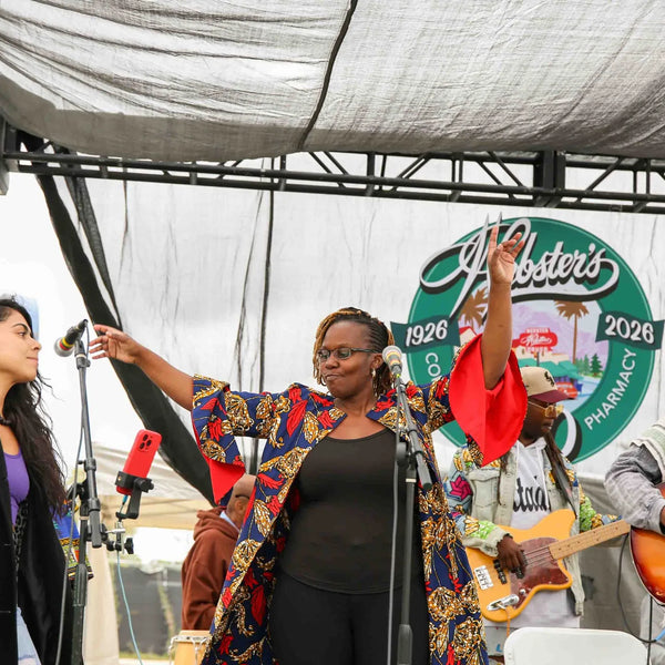 Vocalists performing on stage at Webster's 100th anniversary street fair