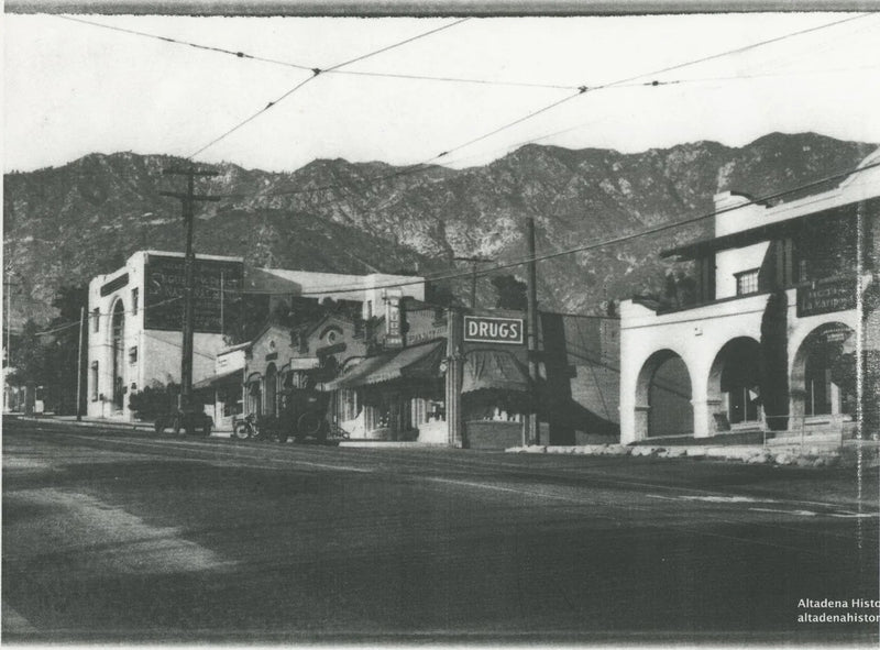 Lake Avenue in Altadena in the 1920s, with the Webster's drugstore sign above the sidewalk and the San Gabriel Mountains behind. Courtesy of the Altadena Historical Society.
